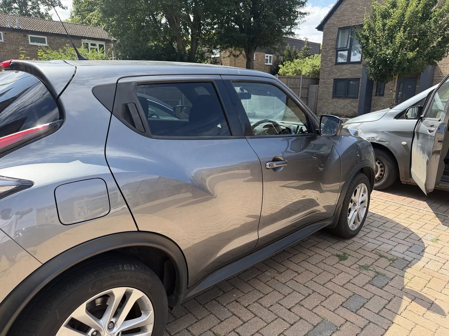 Nissan — door dent repair: finished repair