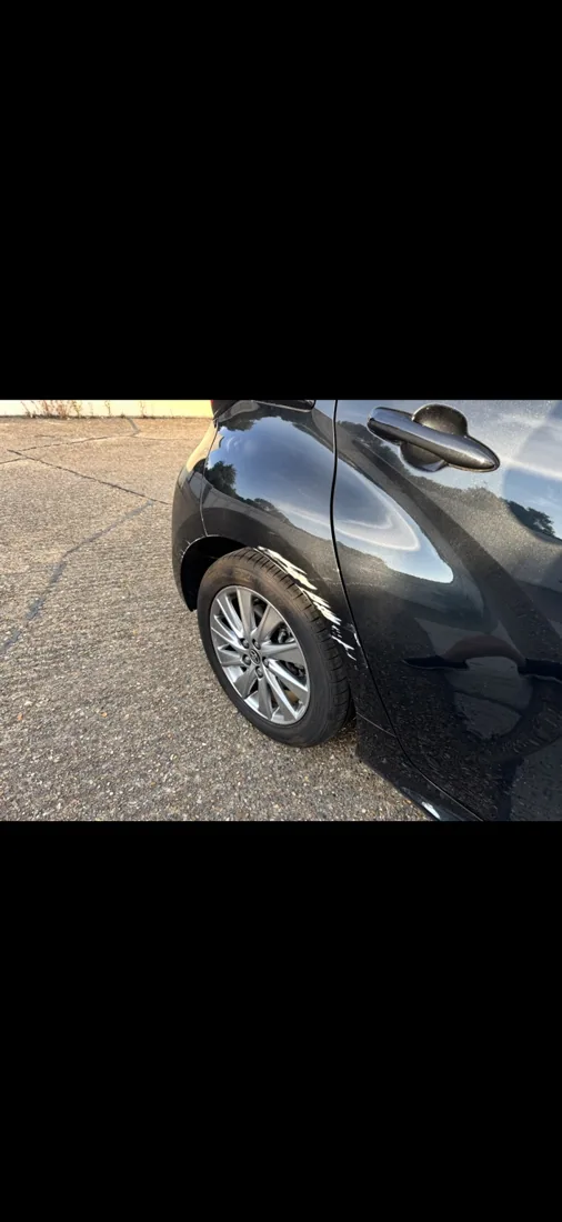 Toyota — wheel-arch scuff repair: repair in progress